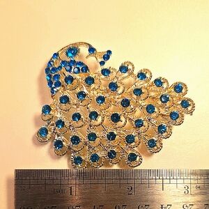 Elegant Silver and Blue Peacock Brooch